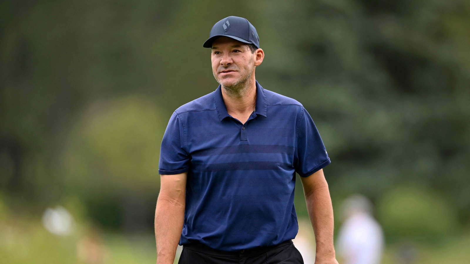 After being placed on leave indefinitely by CBS Sports, Tony Romo discusses personal challenges, including a DUI. (Getty Images via AFP)