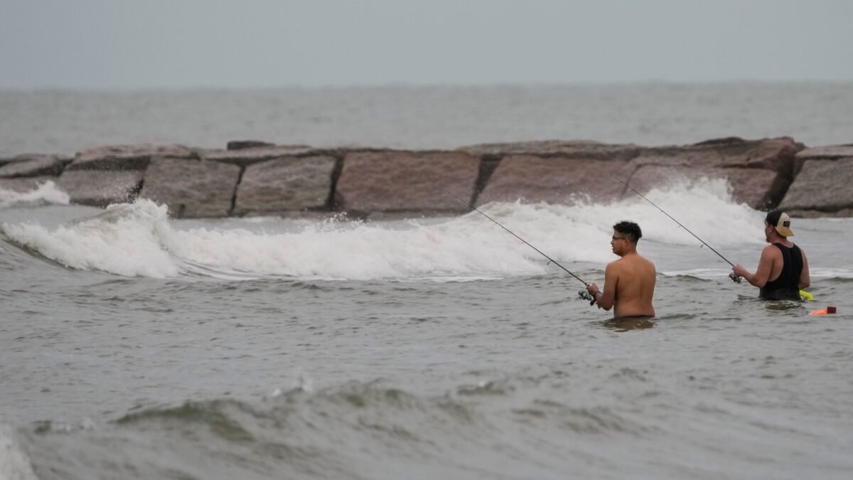 The National Hurricane Center reported that Edouard was located about 15 miles (25 kilometers) south-southeast of Port Arthur, Texas. (Brett Coomer/Houston Chronicle v)
