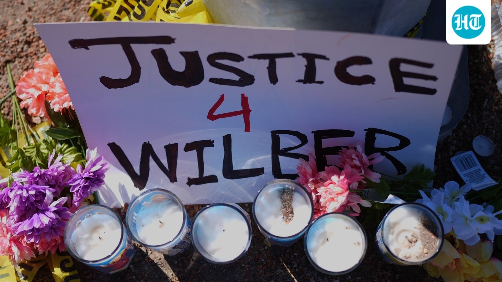 Flowers and candles are seen near the site where a Venezuelan man was shot in his vehicle by an ICE officer in Austin, Texas, Monday, Sept. 21, 2026. (AP Photo/Eric Gay) (AP Photo/Eric Gay)