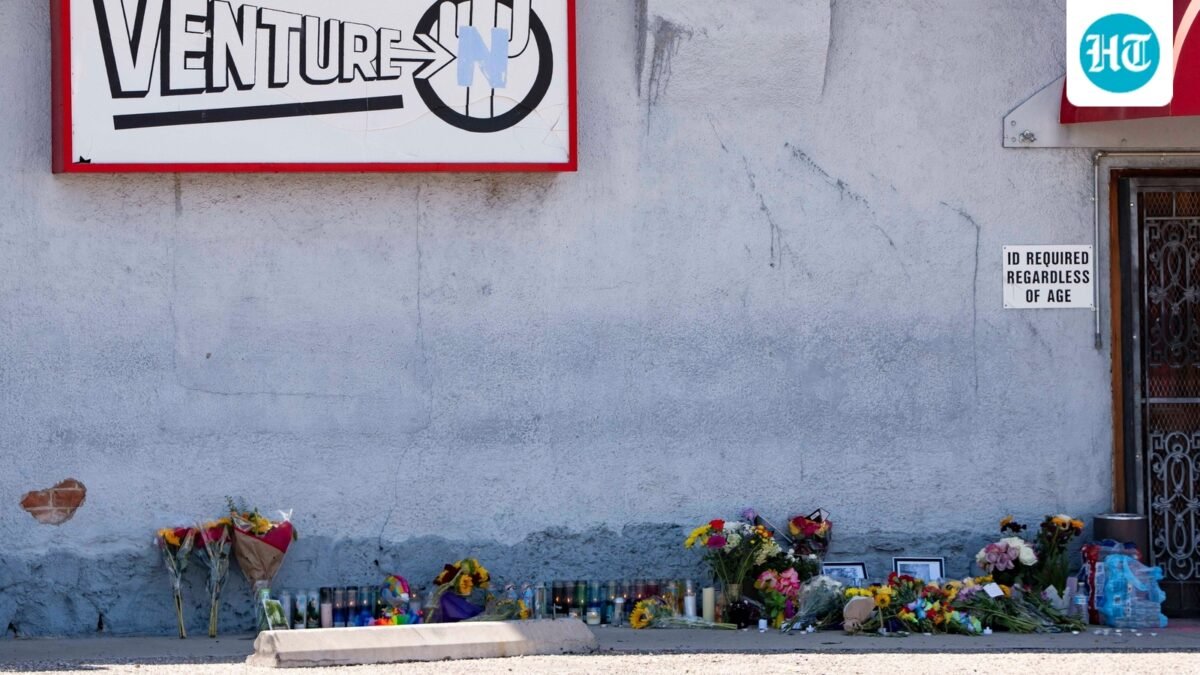 A growing memorial sits outside the Venture-N Bar in Tucson, Ariz., Tuesday, Sept. 1, 2026, for Vincent Siquieros and Cameron Capara, who were fatally shot in the parking lot of the gay bar shortly after midnight Monday. (AP Photo/Rebecca Noble) (AP Photo/Rebecca Noble)