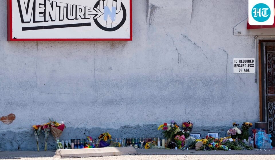 A growing memorial sits outside the Venture-N Bar in Tucson, Ariz., Tuesday, Sept. 1, 2026, for Vincent Siquieros and Cameron Capara, who were fatally shot in the parking lot of the gay bar shortly after midnight Monday. (AP Photo/Rebecca Noble) (AP Photo/Rebecca Noble)