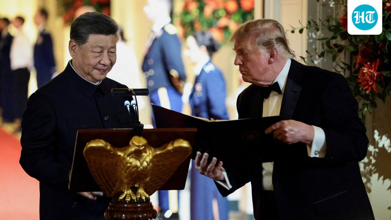 US President Donald Trump holds a binder as he stands next to Chinese President Xi Jinping before Xi delivers a speech during a state dinner at the White House in Washington, D.C., US, September 24, 2026. (REUTERS)