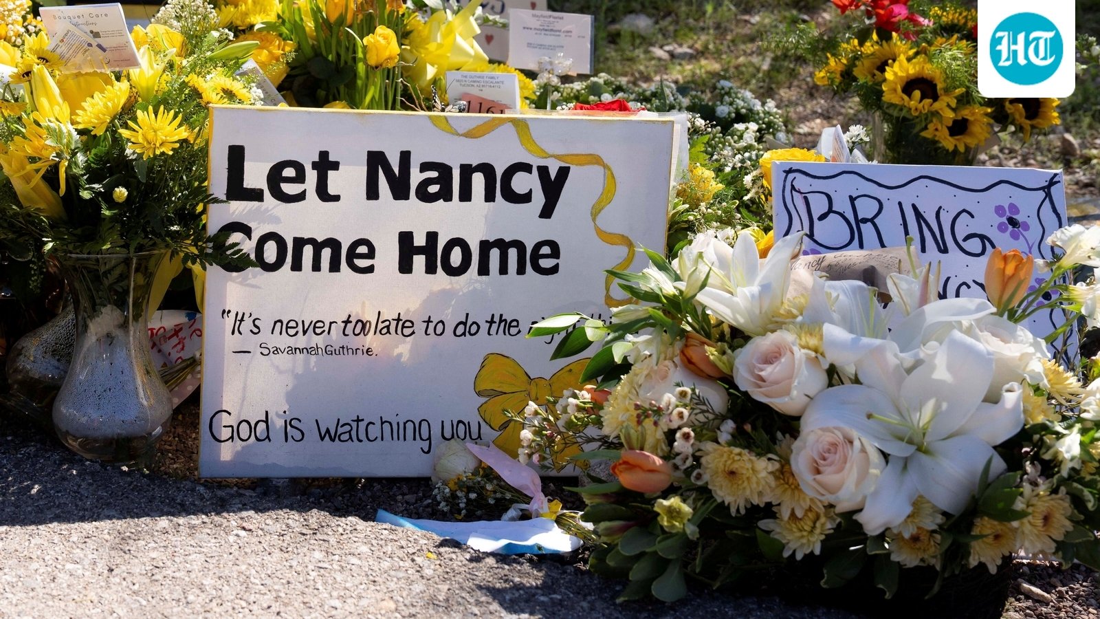 FILE PHOTO: A sign reads stands amid yellow flowers left at the house of Nancy Guthrie, the 84-year-old mother of U.S. journalist and television host Savannah Guthrie, who went missing from her home on February 1, in Tucson, U.S., February 21, 2026.  REUTERS/Rebecca Noble/File Photo (REUTERS)