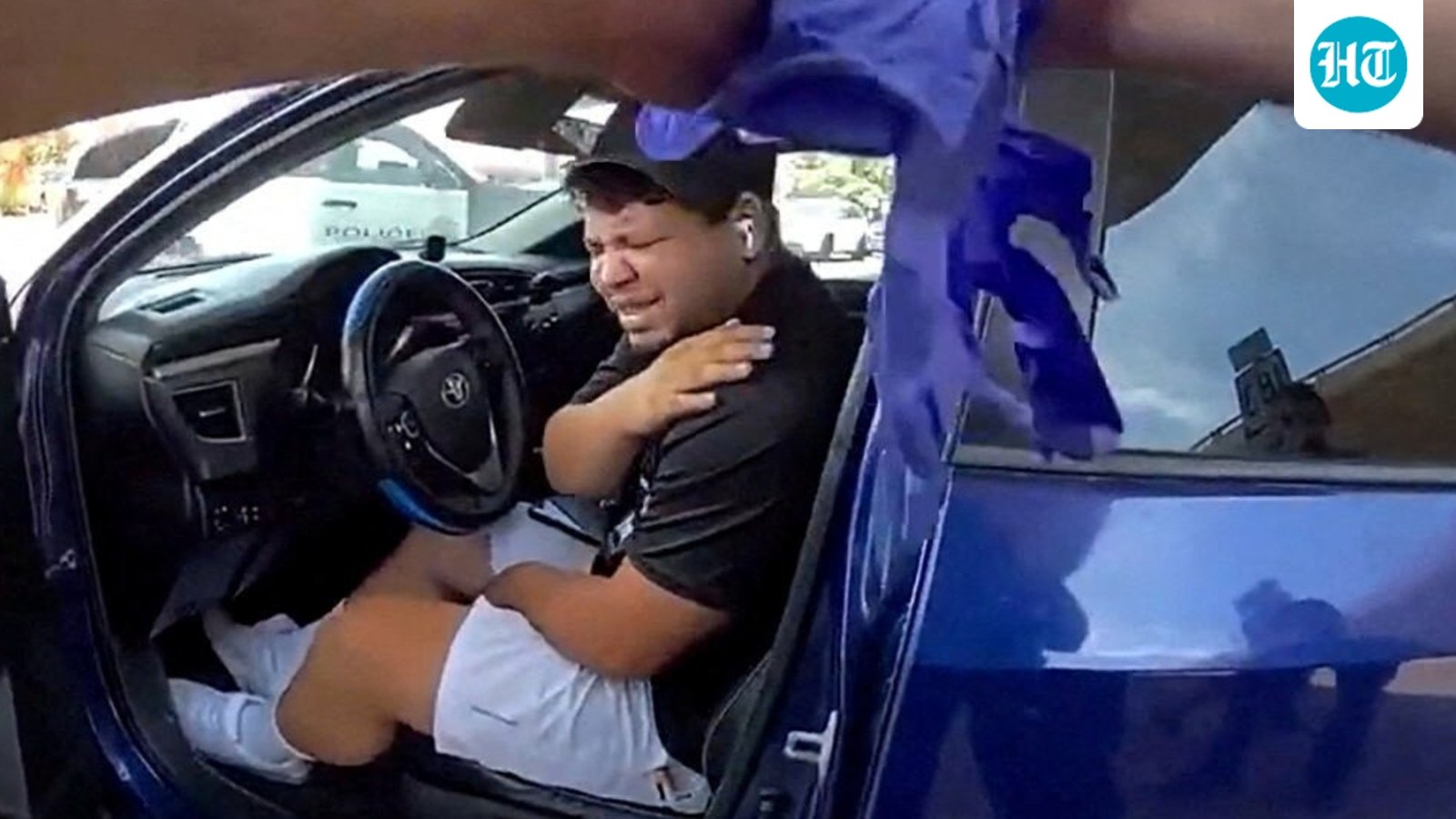 Wilber Rafael Garces Perez, a Venezuelan man who said he had been out working as a DoorDash food delivery driver when shot by a federal immigration agent, holds his shoulder from the wound during his arrest in Austin, Texas, U.S. September 20, 2026 in a still image from police body camera video. (Austin Police/Handout via REUTERS) (via REUTERS)