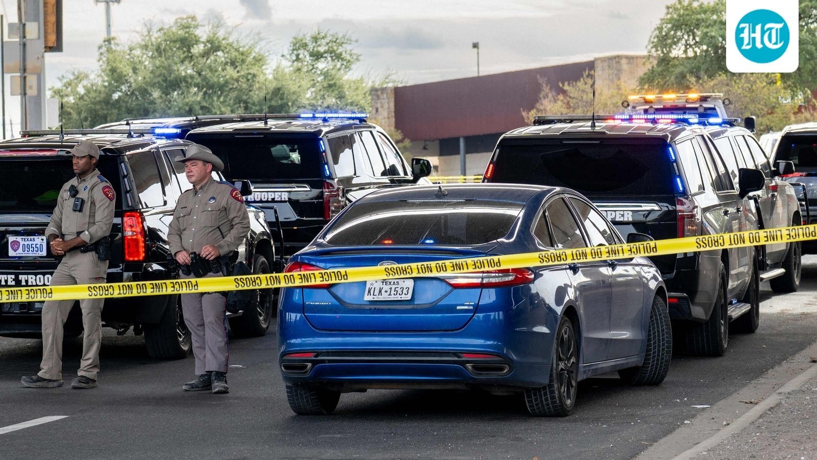 AUSTIN, TEXAS - SEPTEMBER 20: Law enforcement monitor a vehicle that was shot at by Immigration and Customs Enforcement officers on September 20, 2026 in Austin, Texas. A federal ICE officer shot and wounded a person earlier this afternoon in North Austin.   Brandon Bell/Getty Images/AFP (Photo by Brandon Bell / GETTY IMAGES NORTH AMERICA / Getty Images via AFP) (Getty Images via AFP)