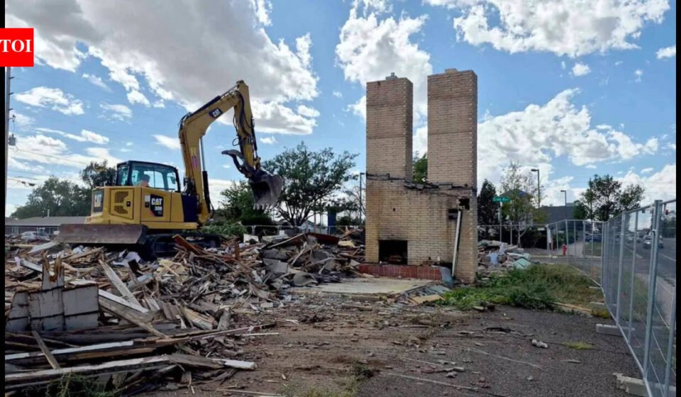 Cheyenne's Twin Chimneys motor court stood for almost 90 years; this week its landmark chimneys fell in about 30 seconds to make way for a drive-thru coffee shop