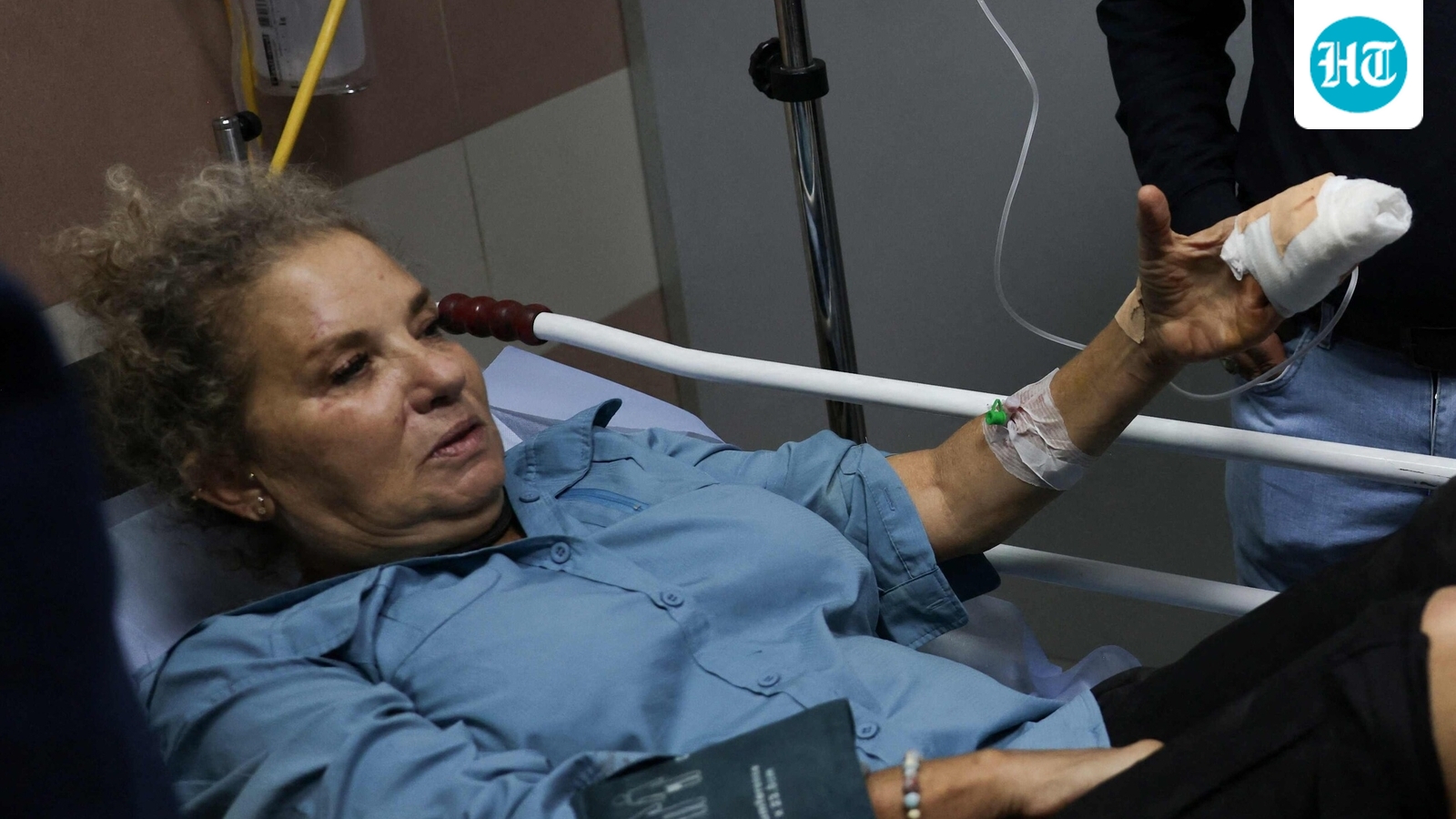 American freelance photojournalist Heidi Levine lies on a gurney in the emergency room of the government hospital in the Israeli-occupied city of Ramallah, as she is treated after being attacked by Israeli settlers while photographing Palestinian farmers harvesting their olives, in the Palestinian village of Abu Falah on October 16. (AFP)
