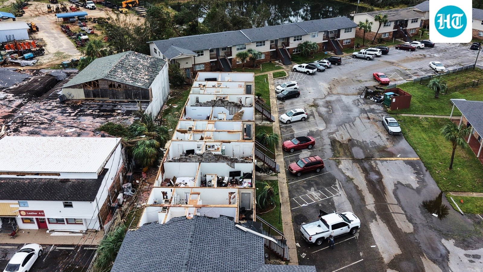 Hurricane Isaias killed four people, damaged buildings, triggered widespread power outages and raised flooding concerns across the Southeast. (AP Photo/Gerald Herbert) (AP Photo/Gerald Herbert)