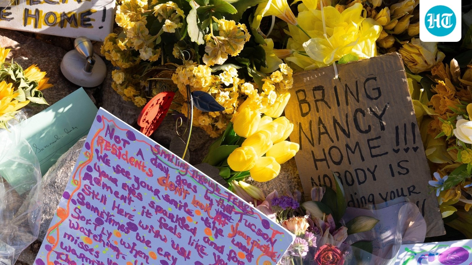 FILE - A collection of yellow flowers and notes sit at the home of Nancy Guthrie, the missing mother of "Today" show host Savannah Guthrie, in Tucson, Ariz., March 6, 2026. (AP Photo/Rebecca Noble, File) (AP Photo/Rebecca Noble)