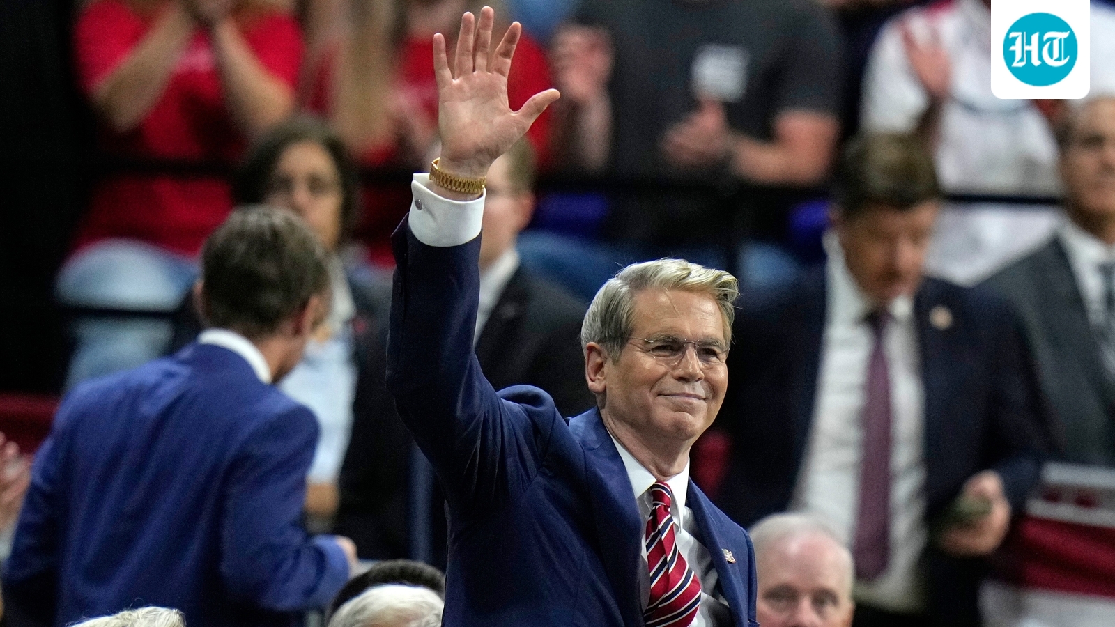 Treasury Secretary Scott Bessent waves as President Donald Trump speaks during a campaign rally, Friday, Oct. 23, 2026, at Alico Arena on the campus of Florida Gulf Coast University in Fort Myers, Fla. (AP Photo/Chris O'Meara) (AP Photo/Chris O'Meara)