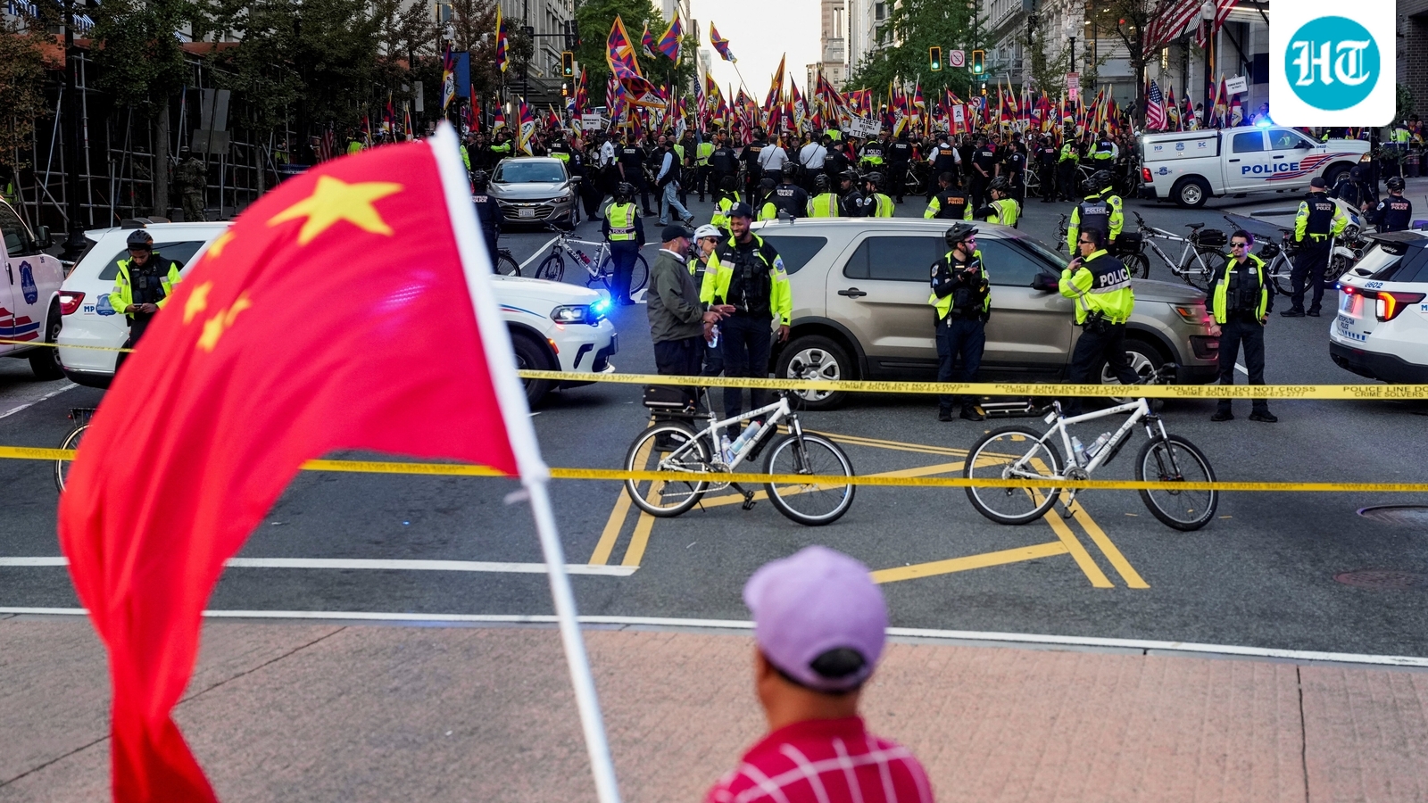A supporter of the Chinese Communist Party (CCP) waves a Chinese flag as pro-Tibet demonstrators rally across the street in Washington, D.C. on September 24, 2026. (REUTERS)