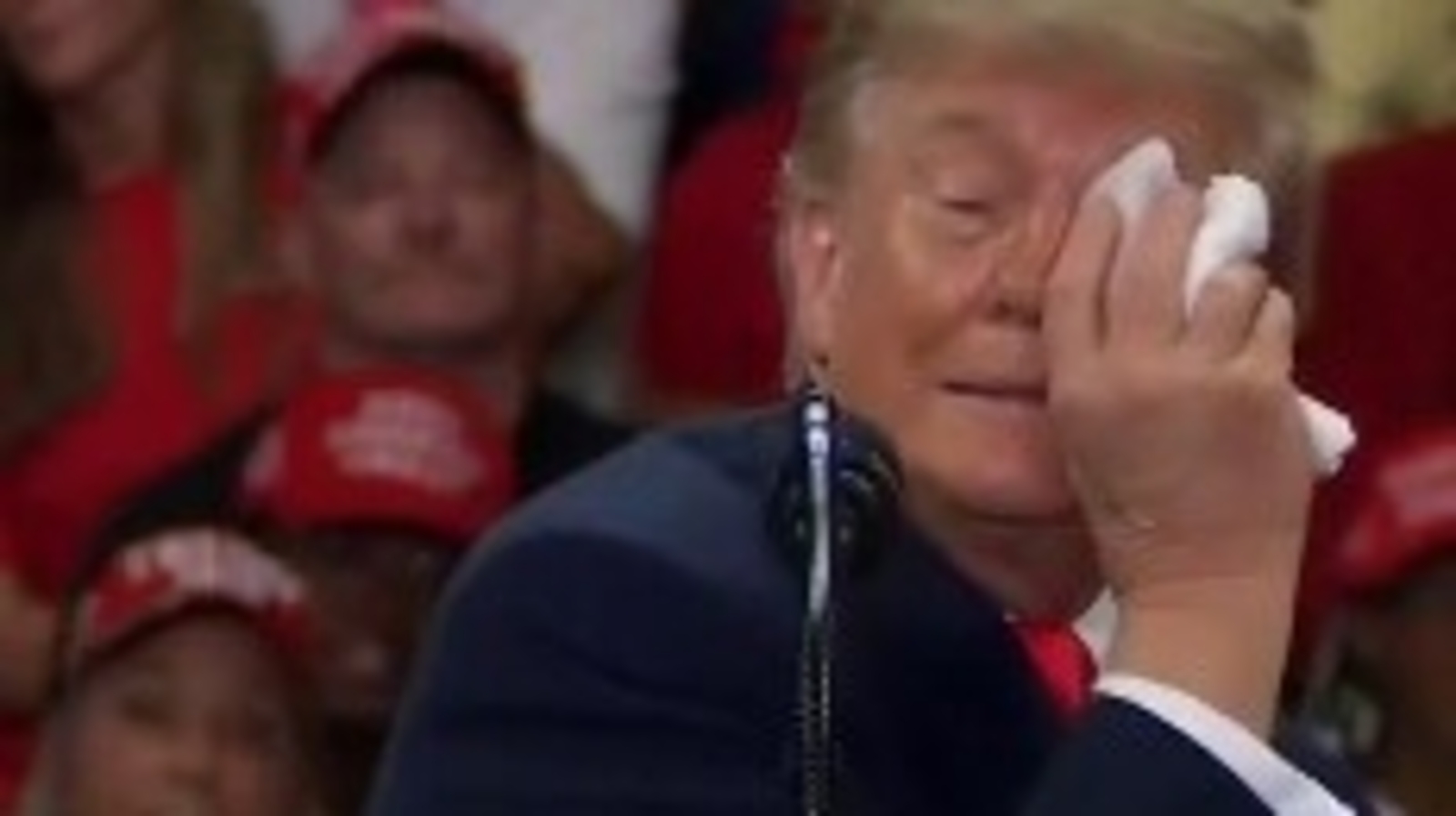 Donald Trump paused during a Daytona Beach rally to wipe his eye with a wet napkin, then resumed speaking.
